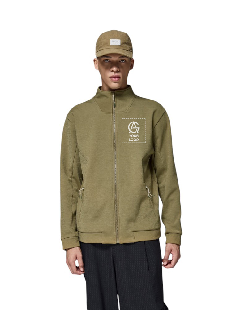A person wearing an olive green zip-up jacket with a patch for a custom logo on the chest and a matching olive green cap, standing against a white background.