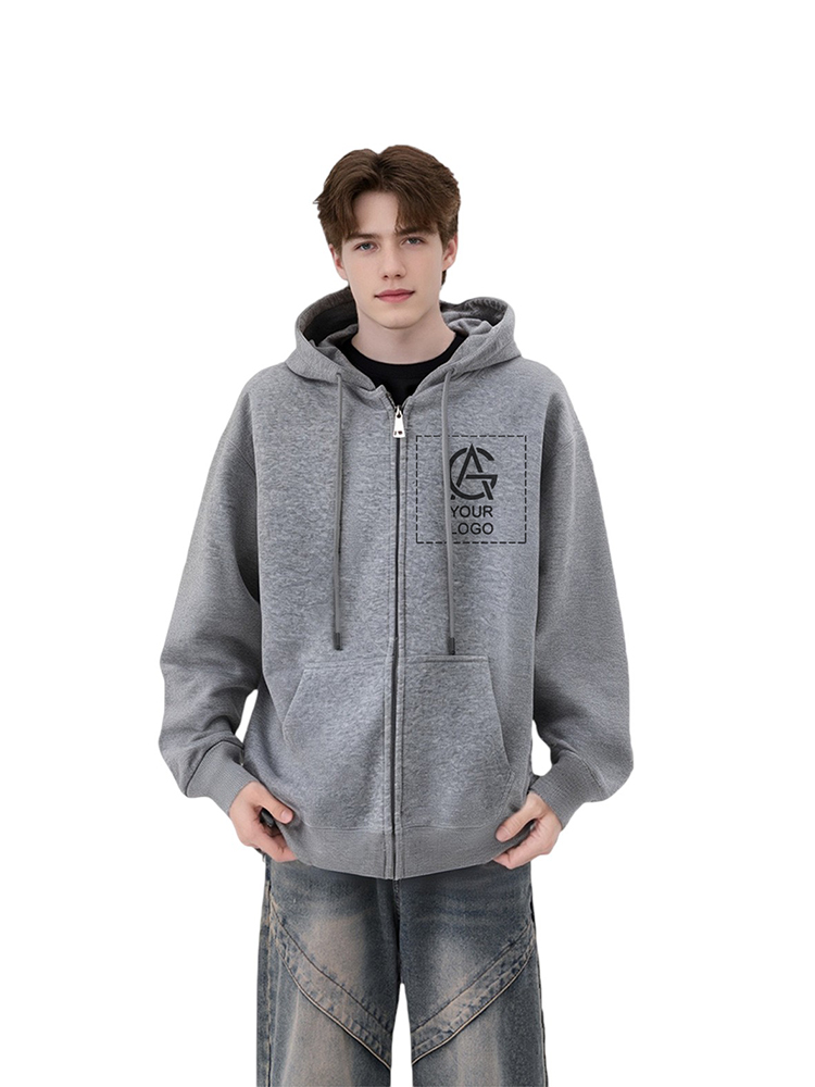 A young person wearing a gray zip-up hoodie with a front pocket and a "Your Logo" graphic on the chest, paired with loose-fitting jeans, standing against a white background.
