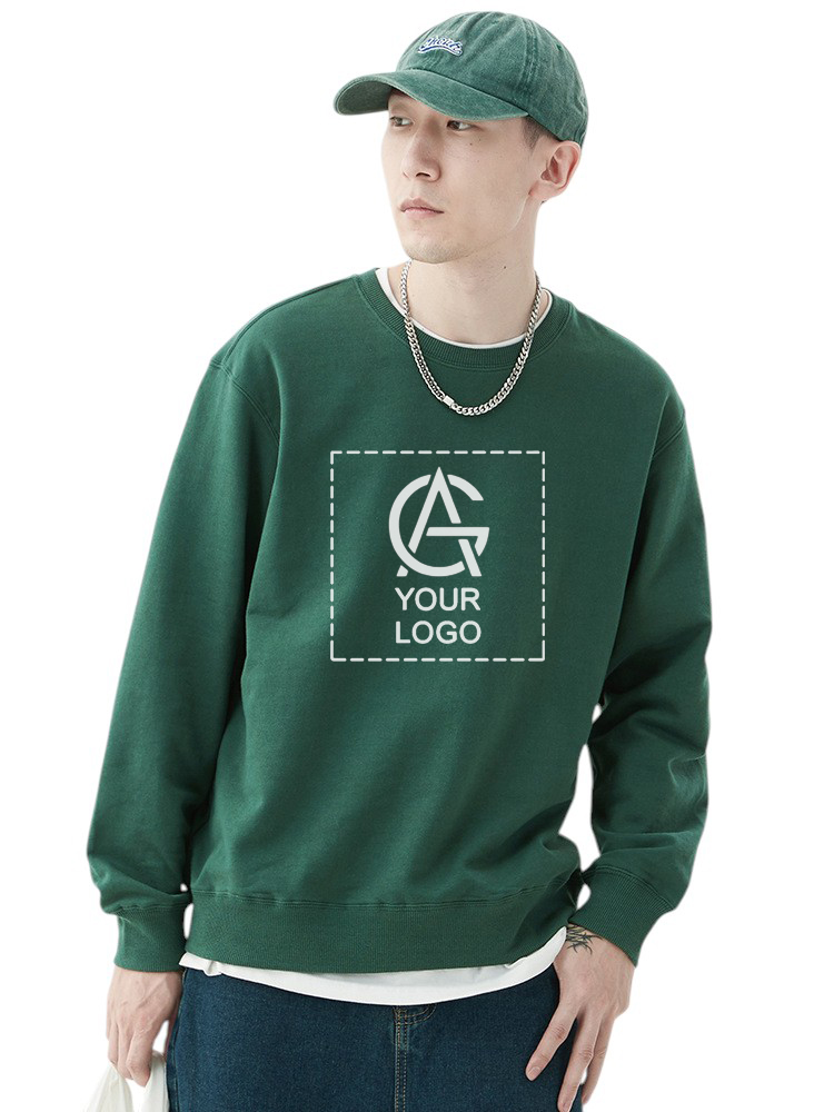 A young man wearing a green R11 sweatshirt and matching cap looks to the side. The sweatshirt features a placeholder graphic labeled "YOUR LOGO" inside a dashed box, highlighting customizable options.