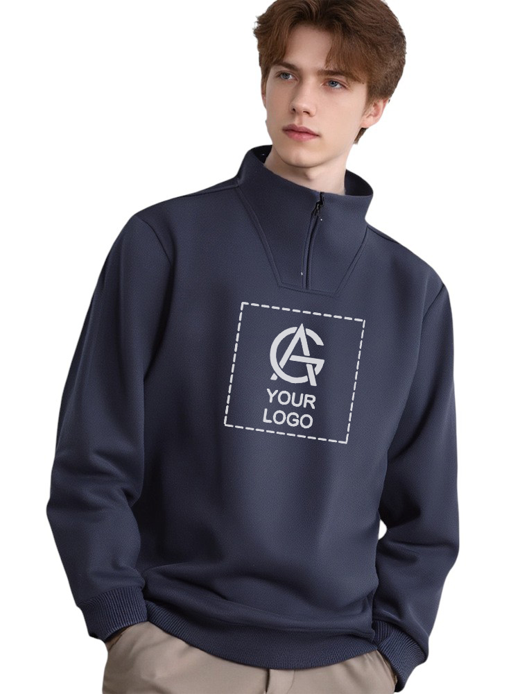 A young man with light brown hair wears a navy blue pullover with a quarter-zip collar and ribbed cuffs. The front features a square placeholder with the text "YOUR LOGO" and a stylized letter "A" inside.