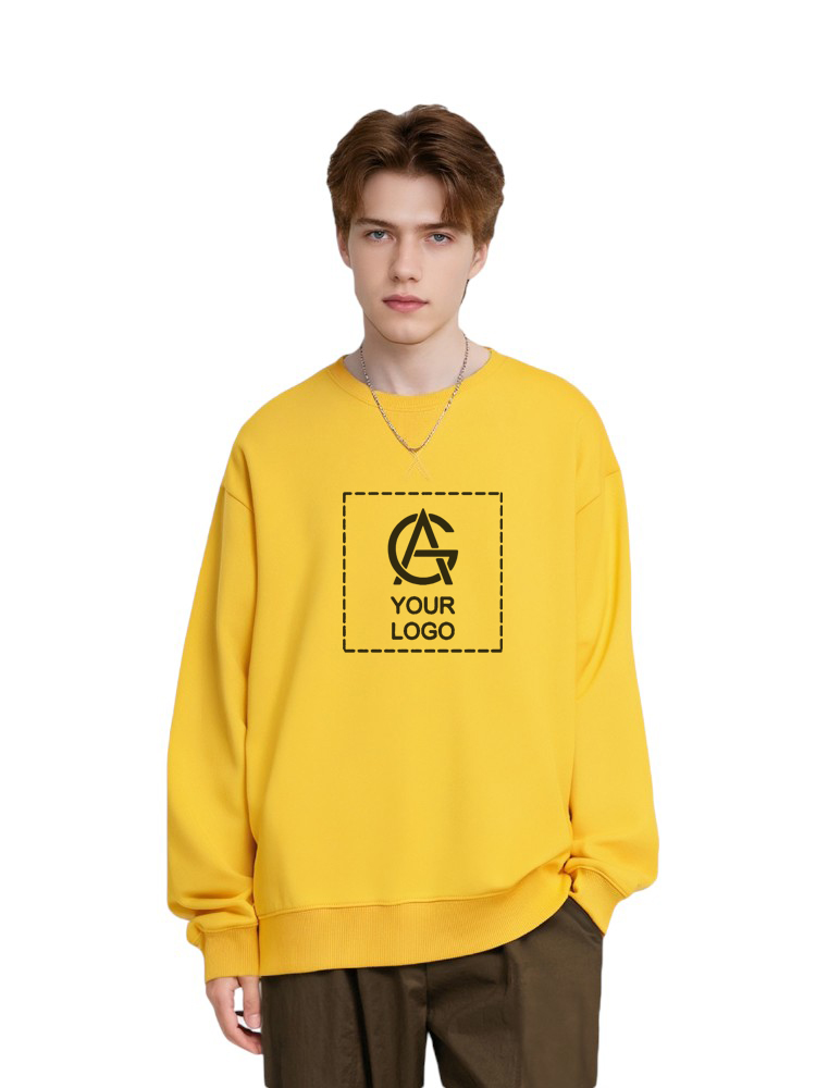 A young person with short light brown hair wears a loose yellow sweatshirt displaying a placeholder logo and the words "YOUR LOGO" on the front, standing against a plain white background.