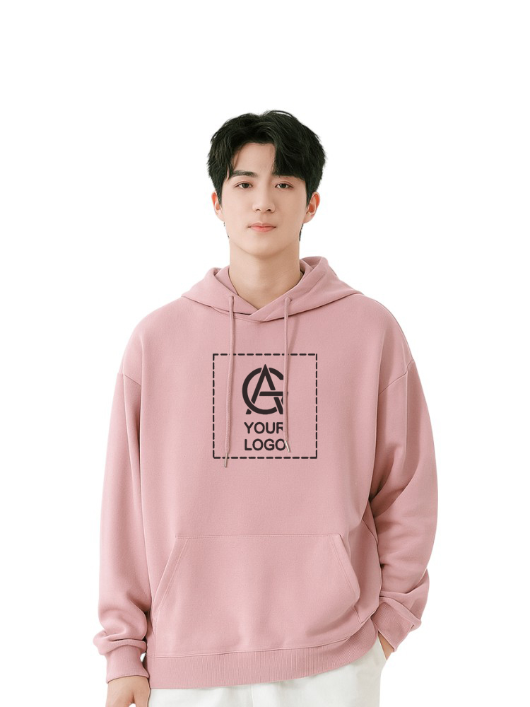 A young person wearing a light pink hoodie with a customizable "YOUR LOGO" design printed in a dashed square on the front, standing against a white background.