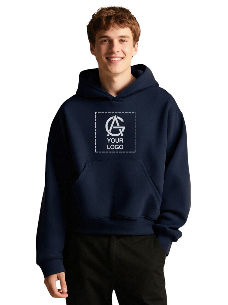 A young person in a navy blue hoodie with a front pocket and a placeholder graphic that reads "Your Logo" in white, standing and smiling against a plain white background.