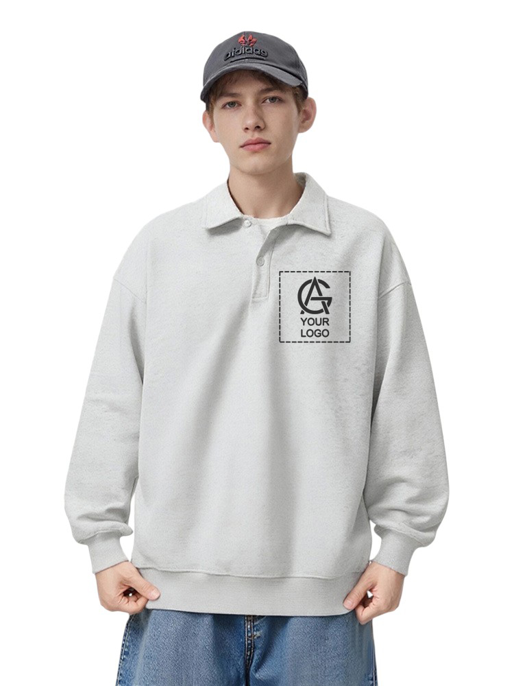 A young person wearing a gray cap, light gray pullover with a polo collar, and blue jeans. The pullover has a placeholder logo and the text "YOUR LOGO" on the left chest area.