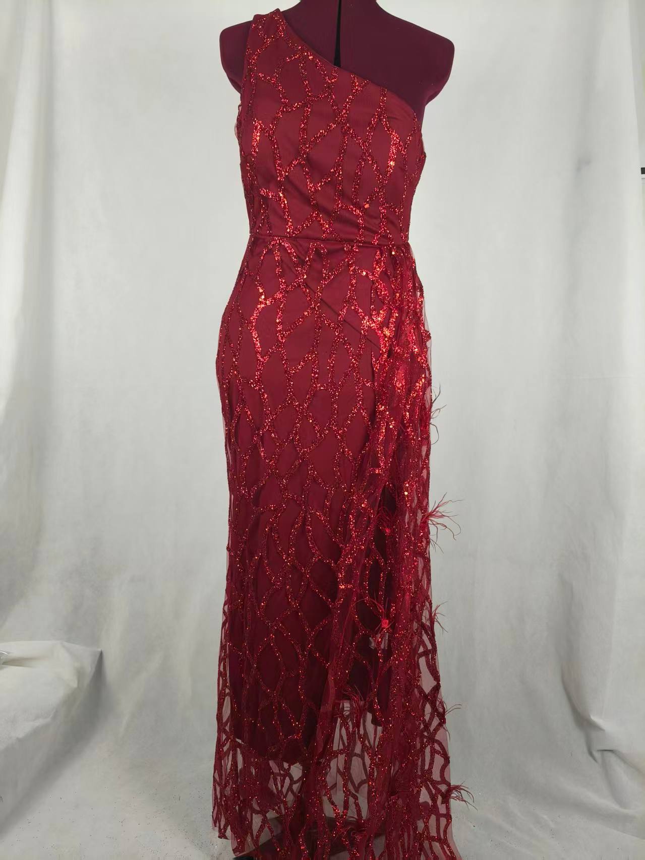 Burgundy one-shoulder evening dress displayed for quality inspection