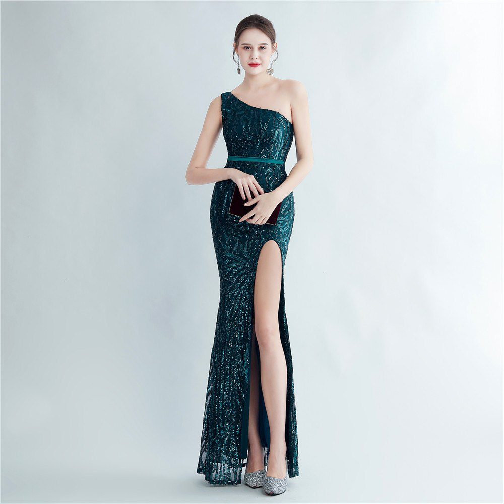 Model wearing a green sequin one-shoulder evening gown