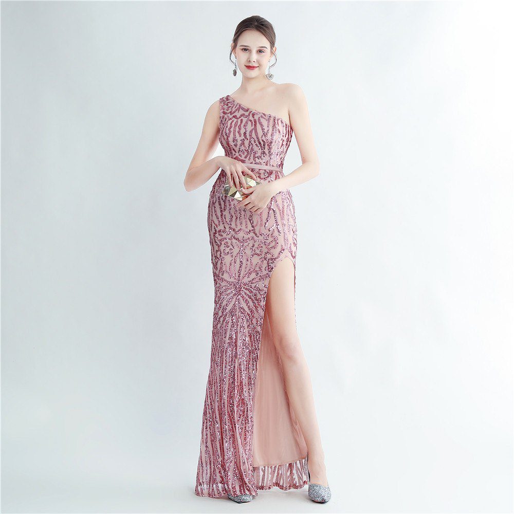 Model wearing a blush pink sequin one-shoulder gown
