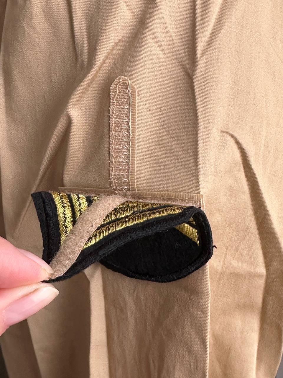 Close-up of interchangeable rank patch with Velcro attachment on custom restaurant uniform shirt