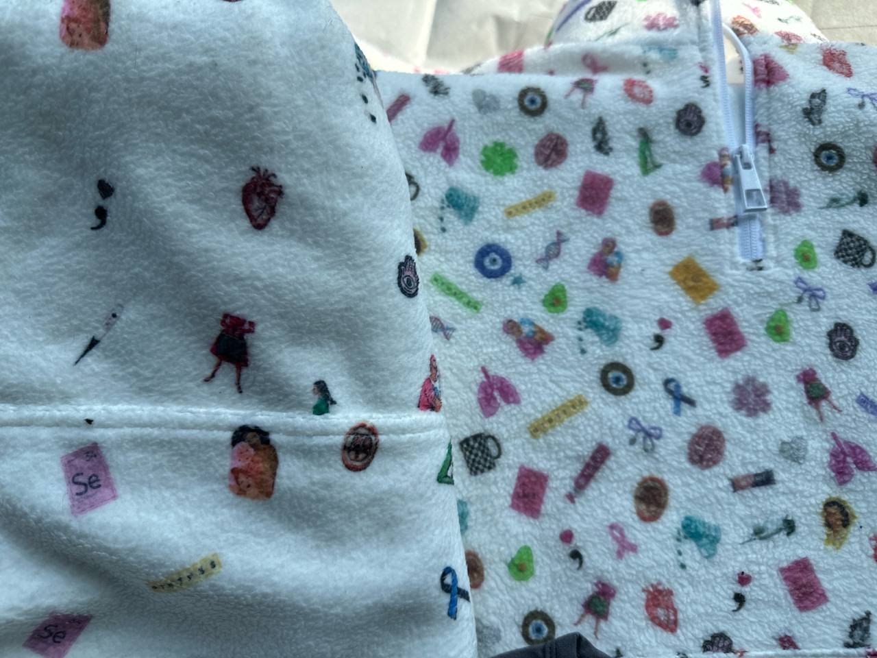 Close-up of custom fleece hoodie with all-over medical print