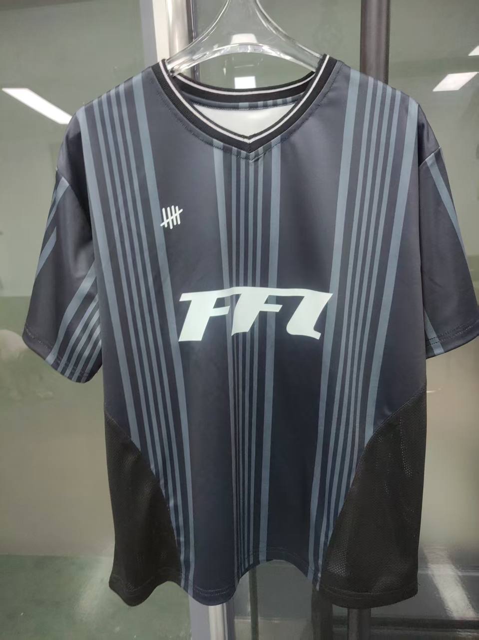 First custom jersey sample with striped design and printed logos